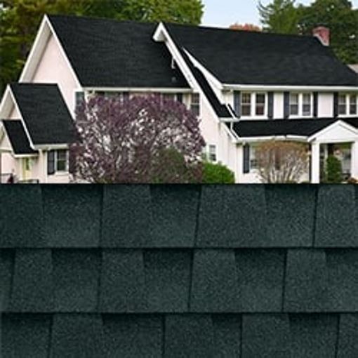 GAF Timberline HDZ charcoal shingle closeup with sample product image on a white house.
