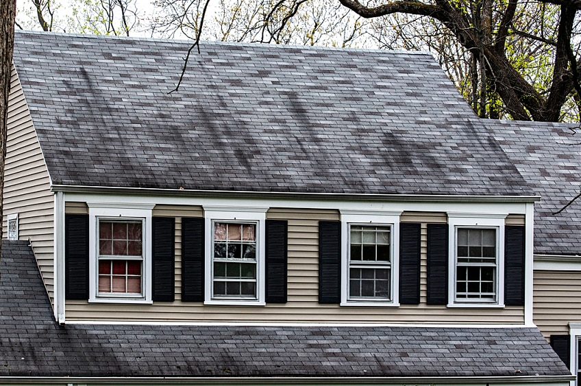 Looking out over a roof ridge toward other homes.