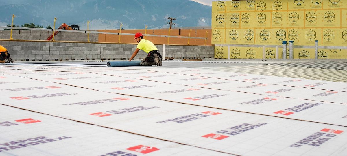 Certified contractors rolling out GAF SA Vapor Retarded XL on Bozeman roof.