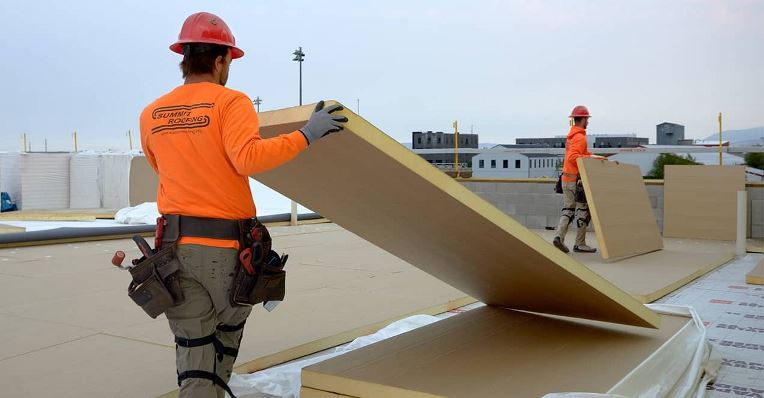 Summit Roofing contractors installing GAF EnergyGuard Polyiso Insulation in Bozeman, MT