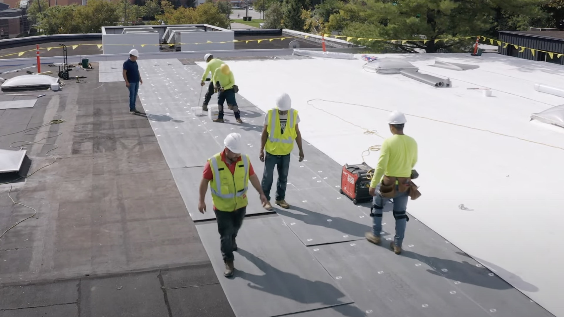 GAF commercial roofing employee in vest