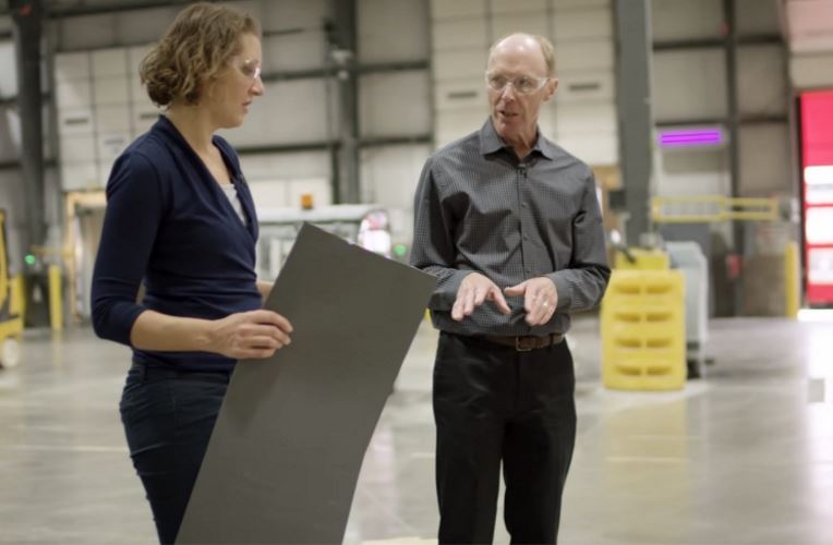 GAF business and roofing science architects discussing designs in a warehouse