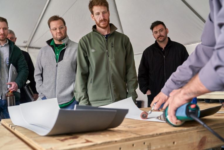 Architects and specifiers watch a GAF instructor during a CARE training course