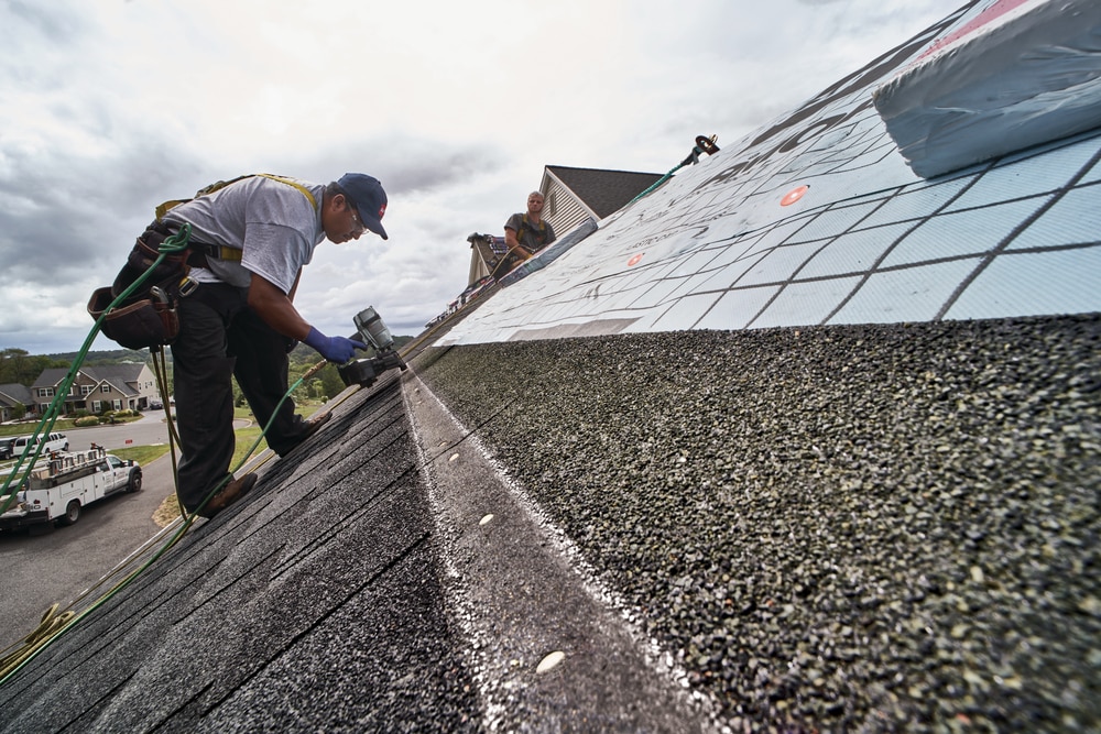 A roofer working on a roof