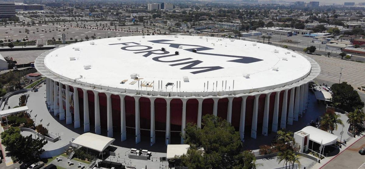 Side-view of Kia Forum with new GAF coated roof