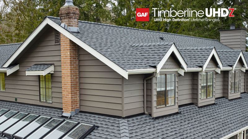 Beauty shot of gray home with UHDZ Pewter Gray shingles.