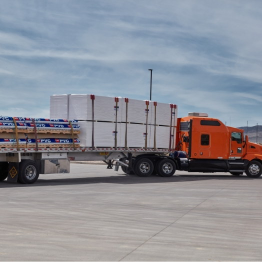 Tractor filled with GAF PVC roofing materials