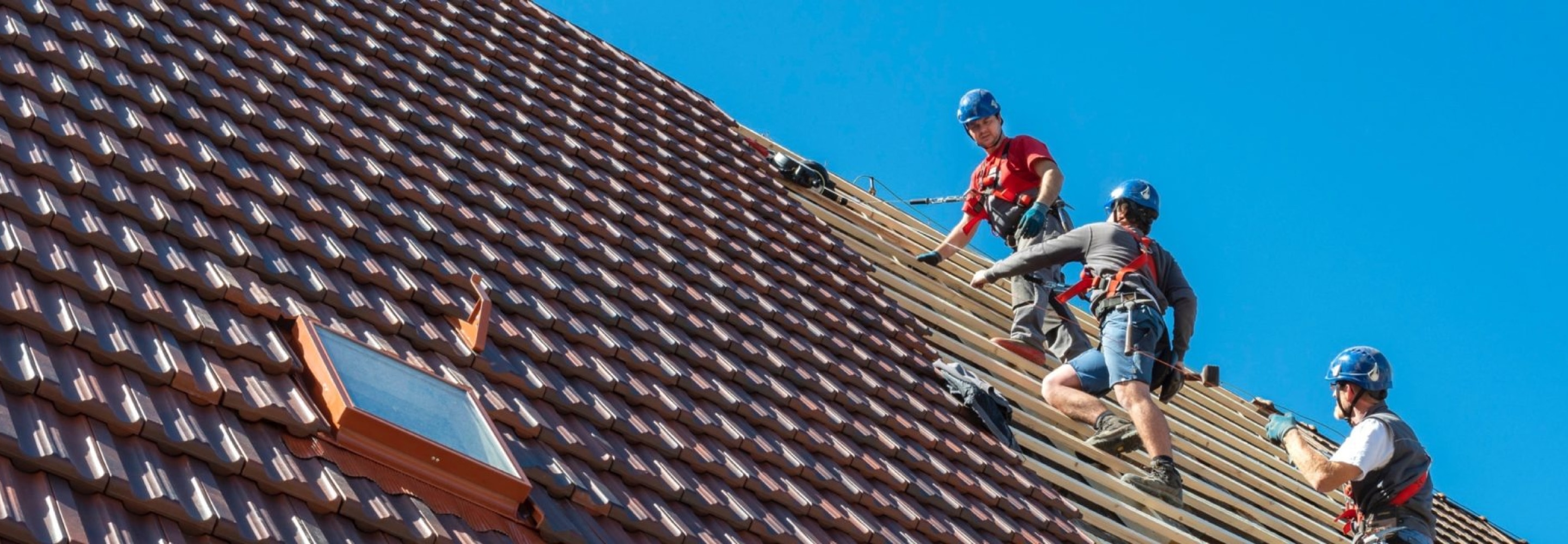 GAF certified roofing contractors installing a steep slope roof.