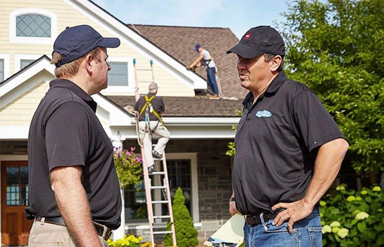 GAF certified contractor outside a home getting a new roof