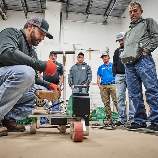 GAF roofer teaching proper installation in our roofer school, GAF Roofing Academy