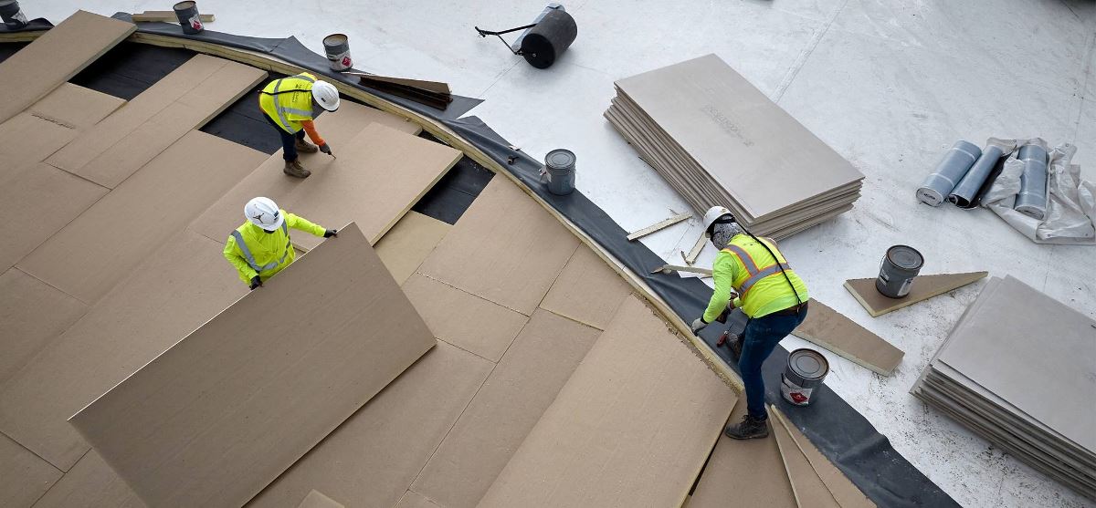 Contractors installing new roof on Savannah Convention Center