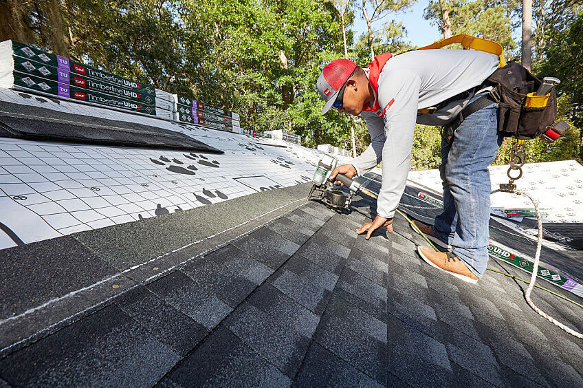 Contractor installing a residential roof