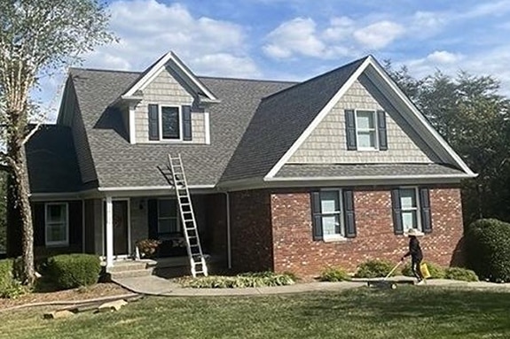 Beige and brick home with GAF roofing shingles