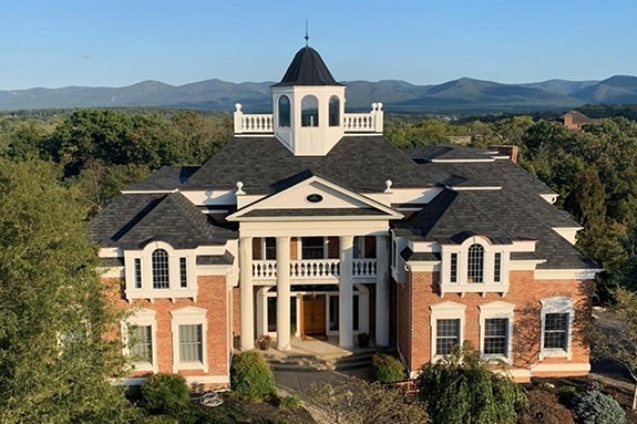 Charcoal Camelot II shingles on stately building