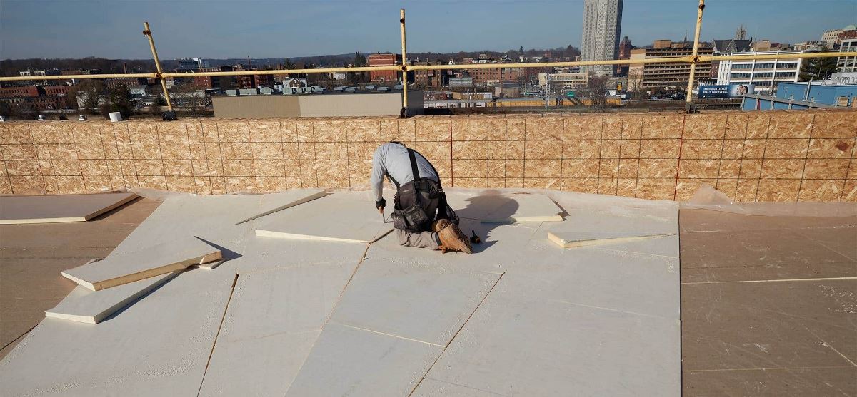 Contractor installing EnergyGuard Polyiso Insulation on The Revington