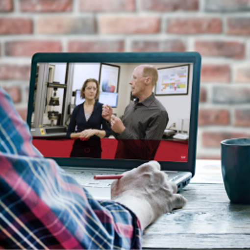 Man watching an architect continuing education course virtually